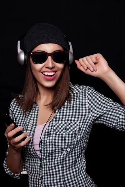 Happy listening music with big headphones  phone or player