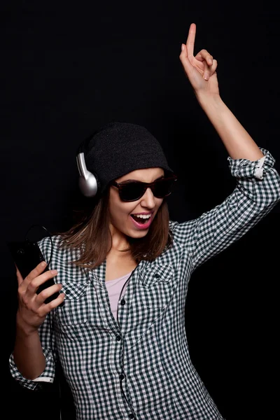 Happy listening music with big headphones  phone or player