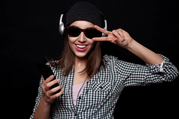 Happy listening music with big headphones  phone or player