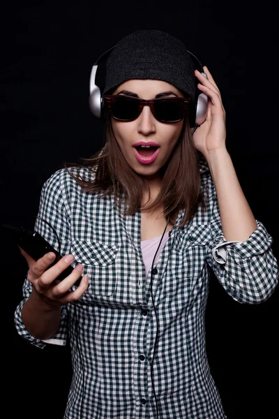 Happy listening music with big headphones  phone or player