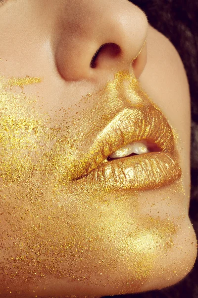 Magic Girl Portrait in Gold. Golden Makeup