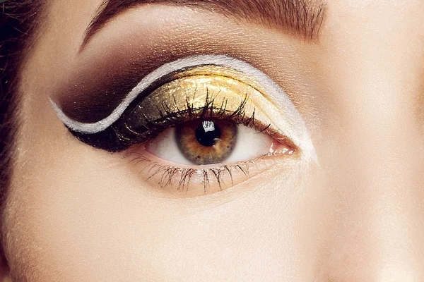 Magic Girl Portrait in Gold. Golden Makeup