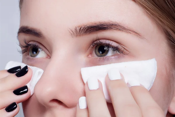 Woman using cotton pad