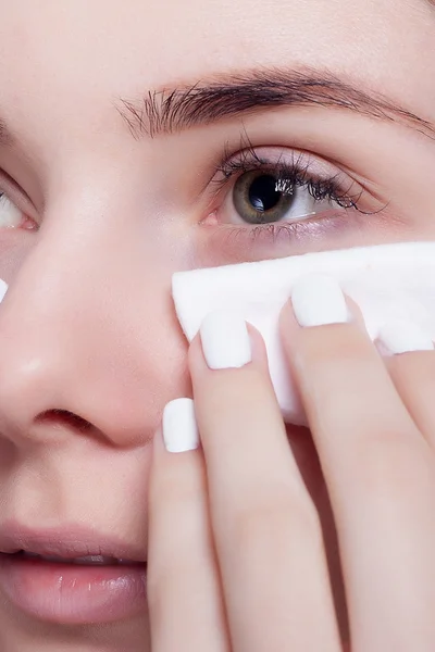 Woman using cotton pad