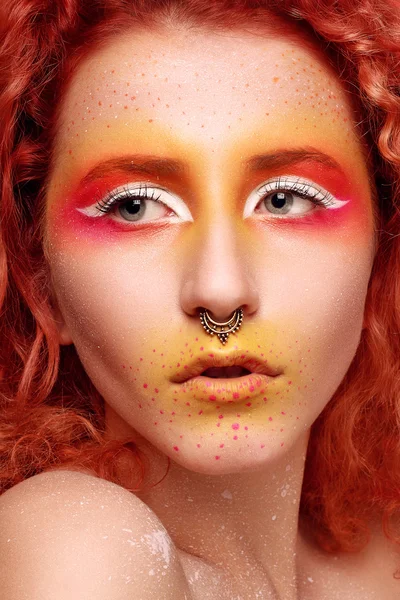 Beautiful Woman with Red Hair and bright makeup