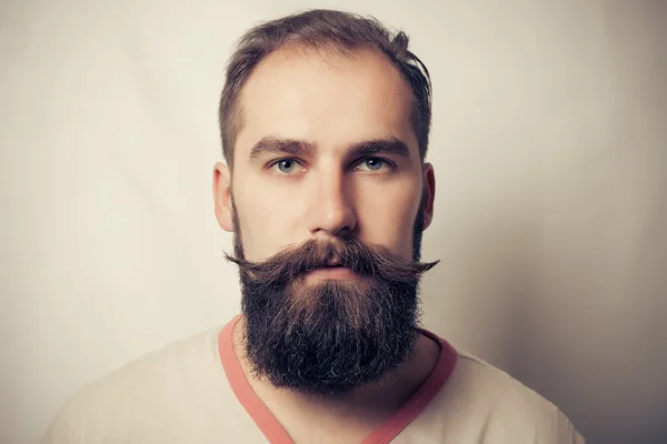 Portrait of tattooed bearded man