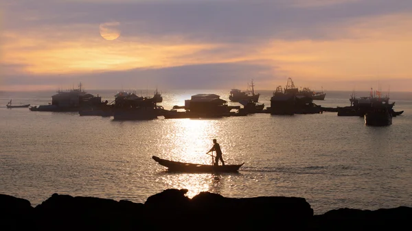 Traditional asian fishing at sunset