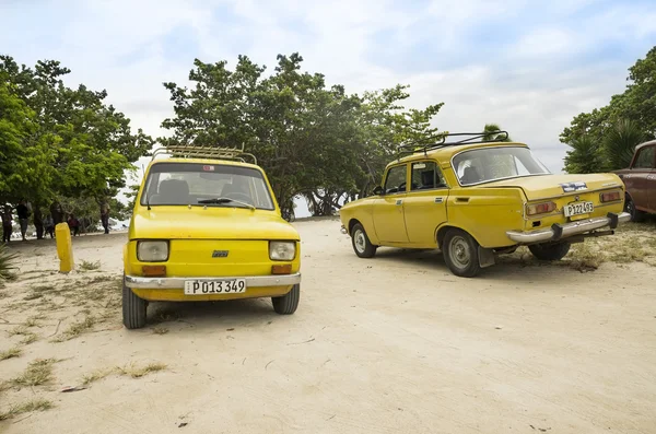 Old cars on Cuban beach