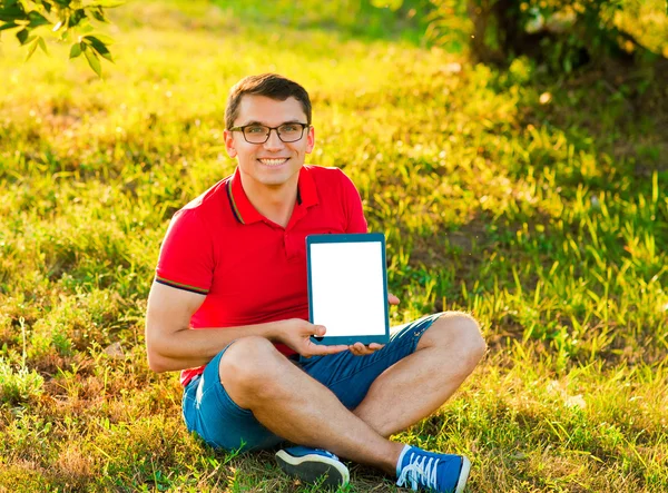 Man holding and shows touch screen tablet pc
