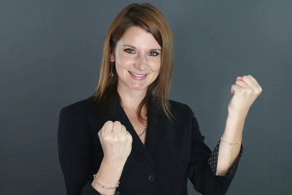 Happy young woman clenching his fists