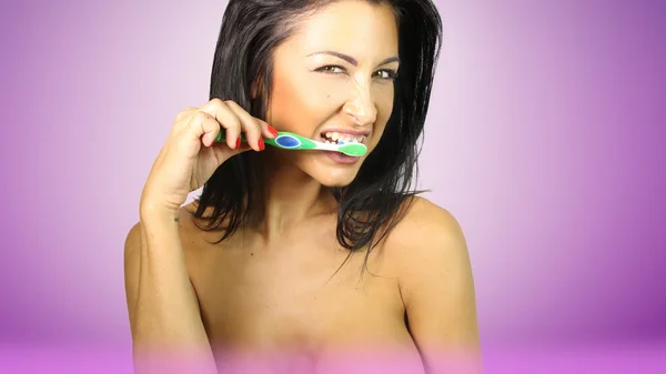 Beautiful Woman Brushing Teeth with Fun