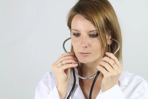 Beautiful doctor holding a stethoscope