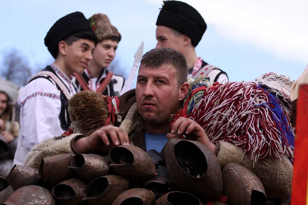 Men in traditional masquerade costume