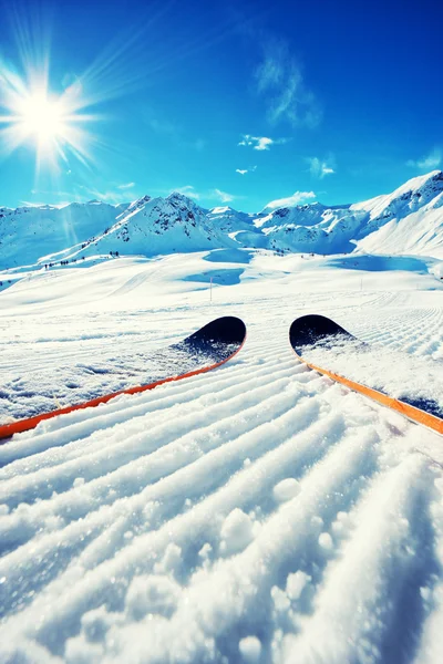 Skis in snow in Mountains