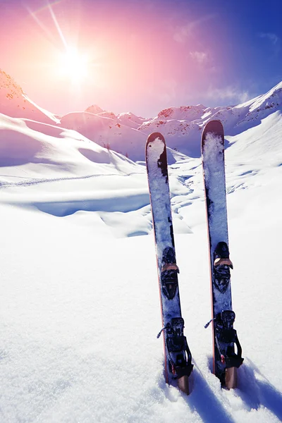 Skis in snow in  Mountains