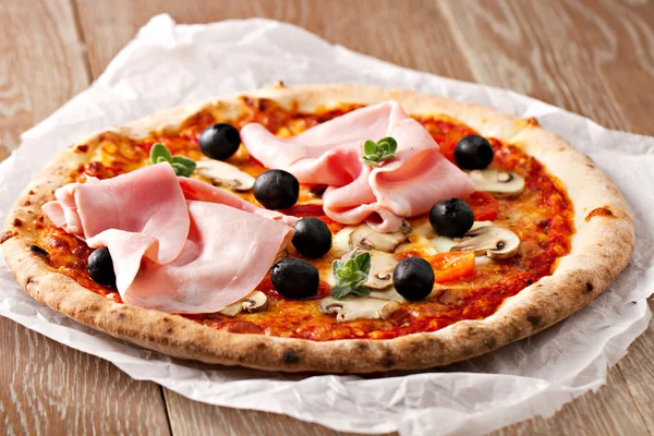 Pizza with olives, ham