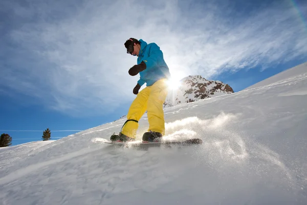 Young man snowboarding