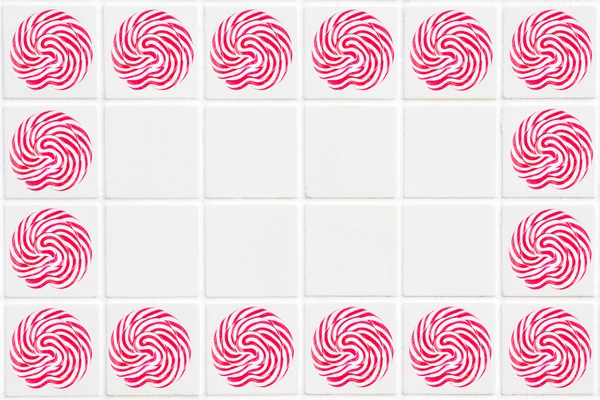 White ceramic tile in square form with red lollipop pattern