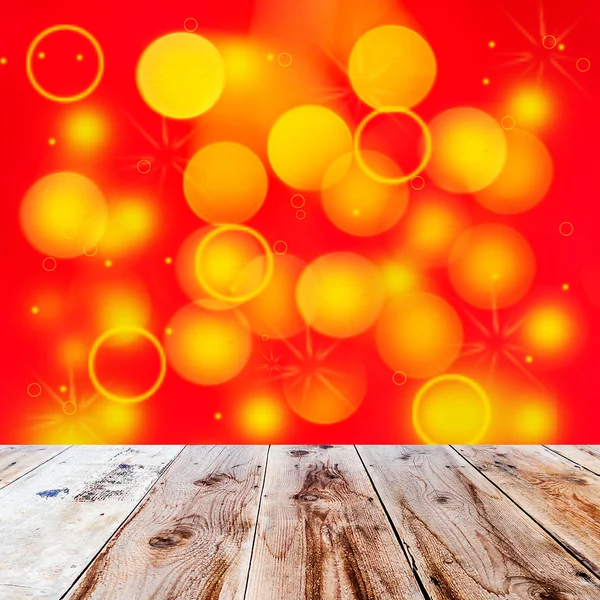 Wooden floor and yellow lights on red wall