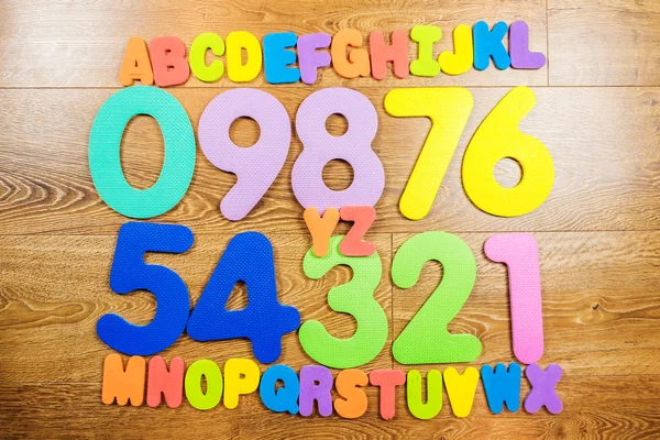 Plastic numbers and letters in four rows