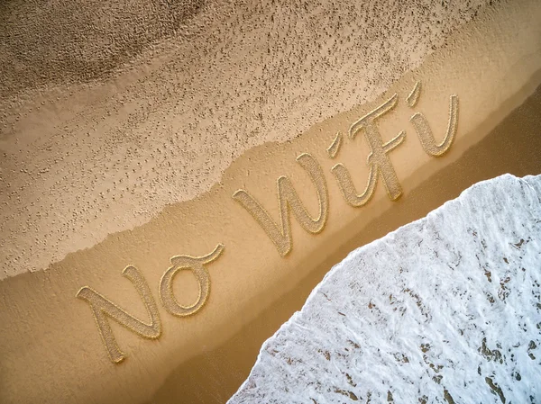 No Wifi written on the beach