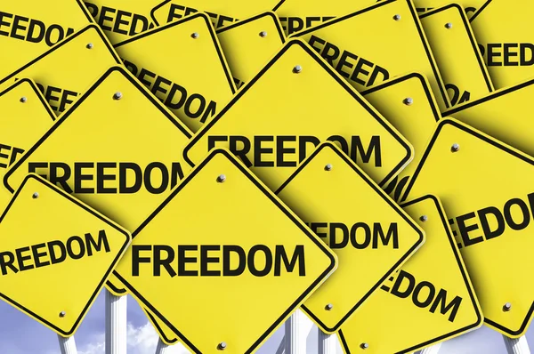 Freedom written on multiple road sign