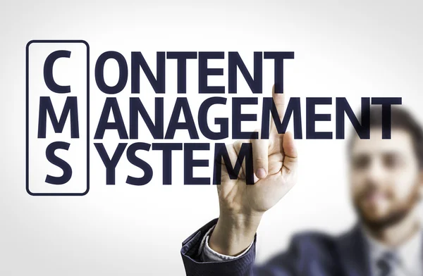 Business man pointing the text: Content Management System