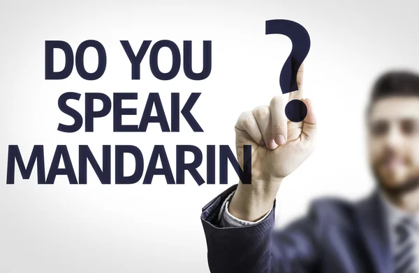 Business man pointing the text: Do you Speak Mandarin?