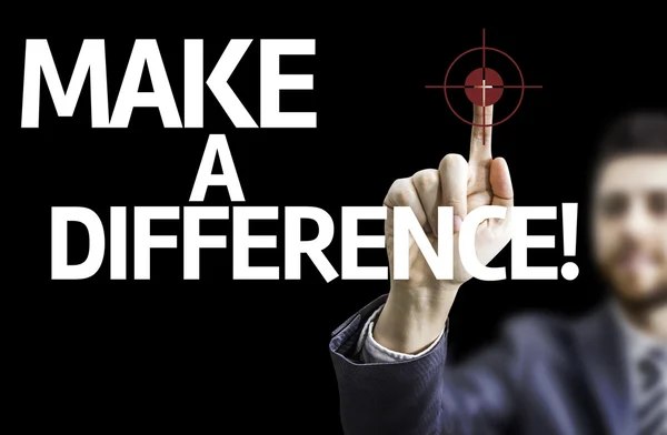 Business man pointing the text: Make a Difference