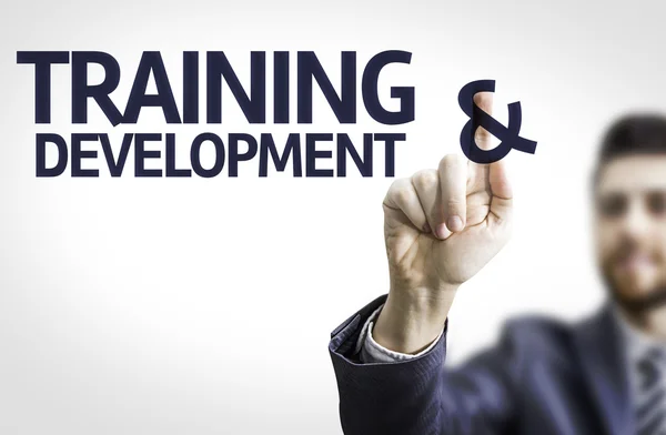 Business man pointing the text: Training & Development