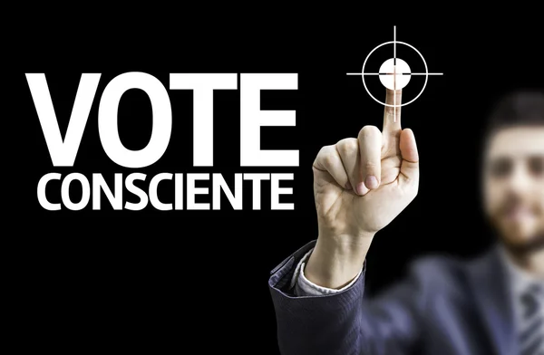 Business man pointing the text: Conscious Vote (In Portuguese)