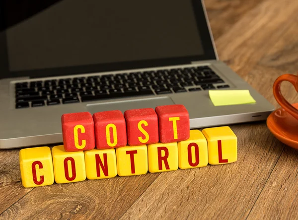 Cost Control written on cubes