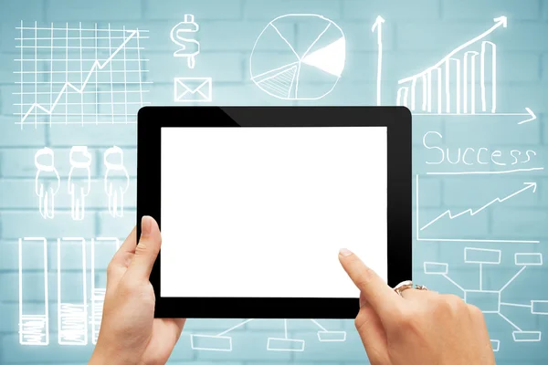Close-up digital tablet with blank screen against drawing busine