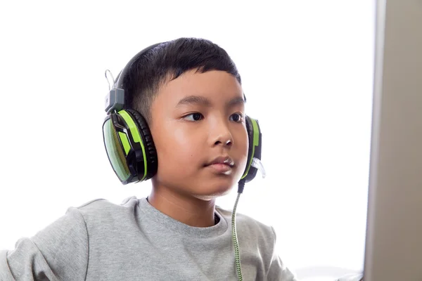 Asian kid play computer games (closeup shot)