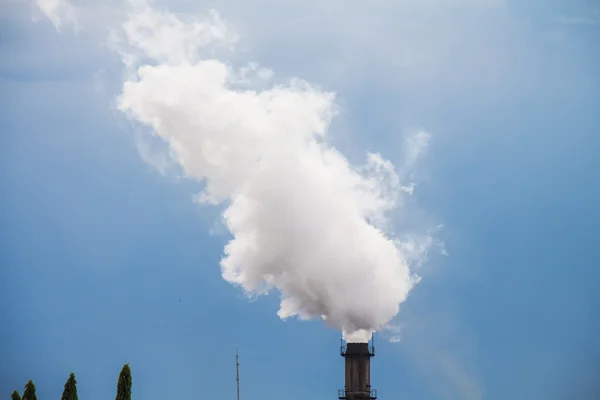 Industrial smoke from chimney to sky