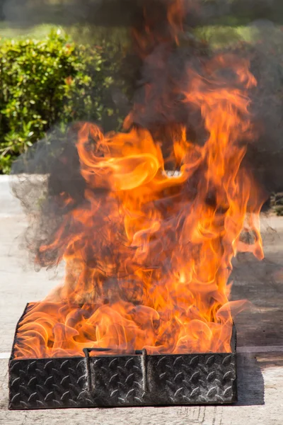 Flame in container on fire fighting safety training