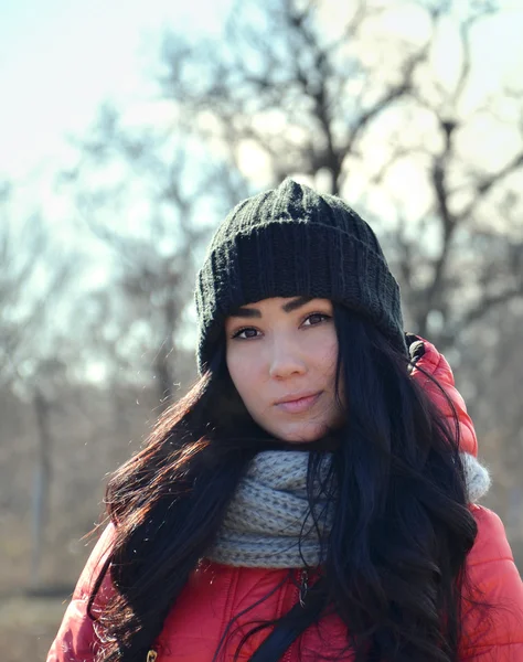 Dark-haired girl in cap