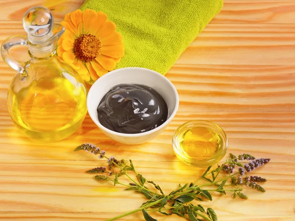 Massage oil and therapeutic clay mud black flowers