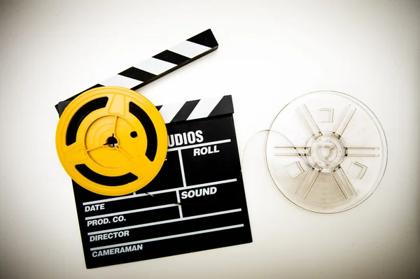 Movie clapper board and super 8 mm reels vintage color effect