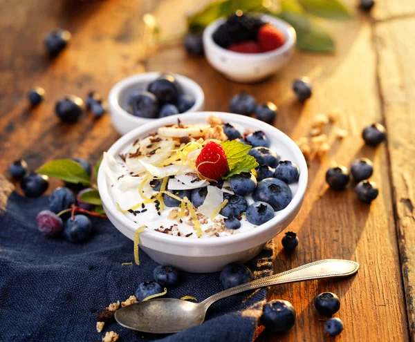 Natural yogurt with organic blueberries, bananas and muesli.
