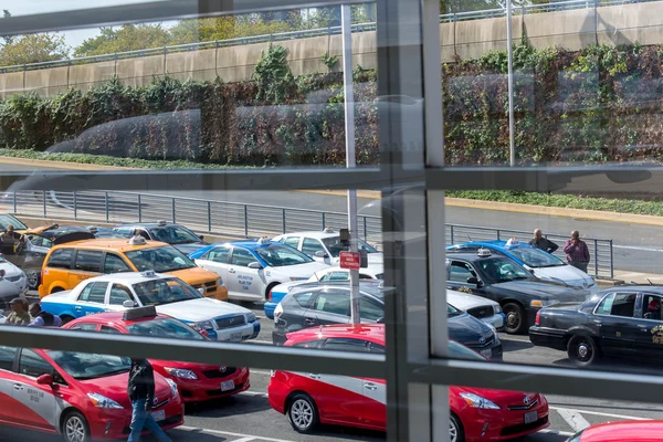 View of the taxi line out an airport window