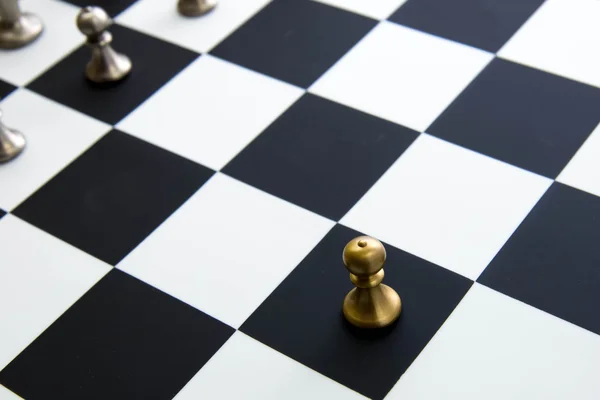Chess game - pawn alone in front on chessboard