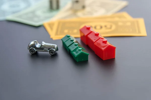 February 8, 2015: Houston, TX, USA.  Monopoly car, dice, money,