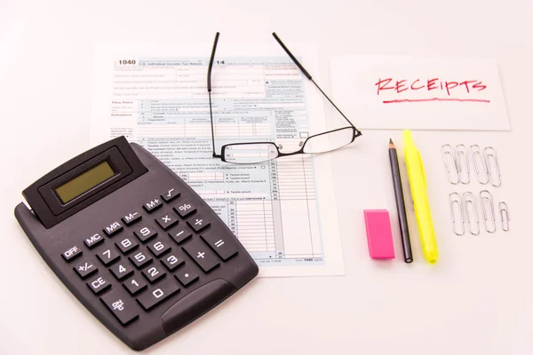 Tax preparation supplies, reading glasses and tax forms