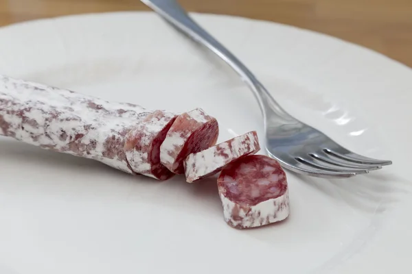 Salami party and fork