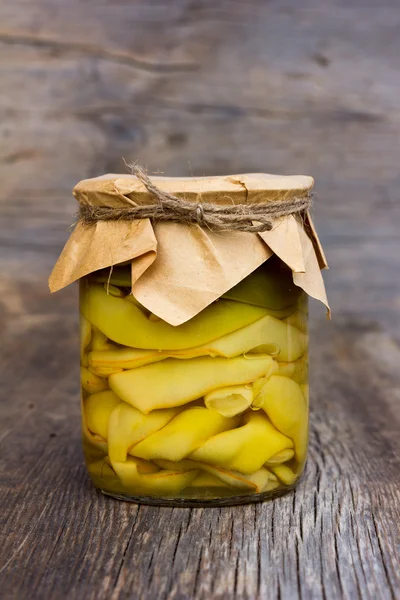 Marinated green beans in a glass jar closeup. home canning. Armenian food