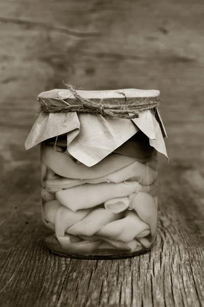 Marinated green beans in a glass jar closeup. home canning. Armenian food. black and white photo