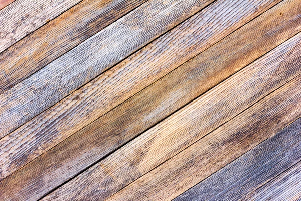 Background texture old gray barn board with diagonal wooden slats