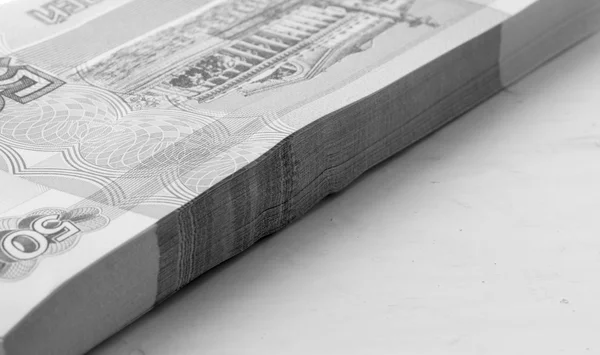 The national currency of Russia. a stack of new paper money. shallow depth of field. black and white photo