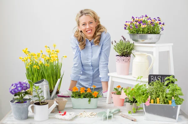 Happy gardener with flowers